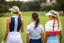 Golfing girls on fairway wearing golf tops, bottoms, skirts and golf dress
