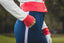 Women's golf bottoms girl wearing navy blue golf trousers on course